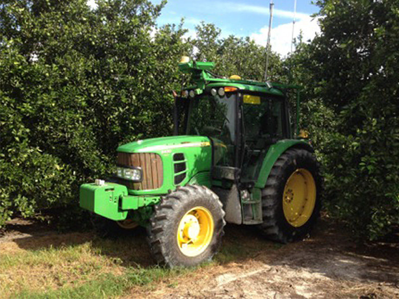 Autonomous John Deere tractor in an orchard by the National Robotics Engineering Center (NREC). 